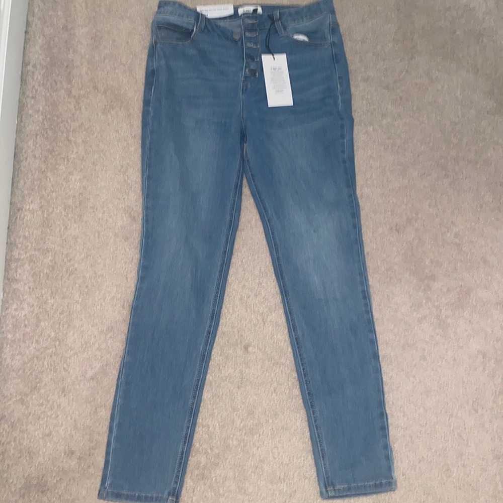 Selling blue jeans that didn’t fit. They are a size 13/30.